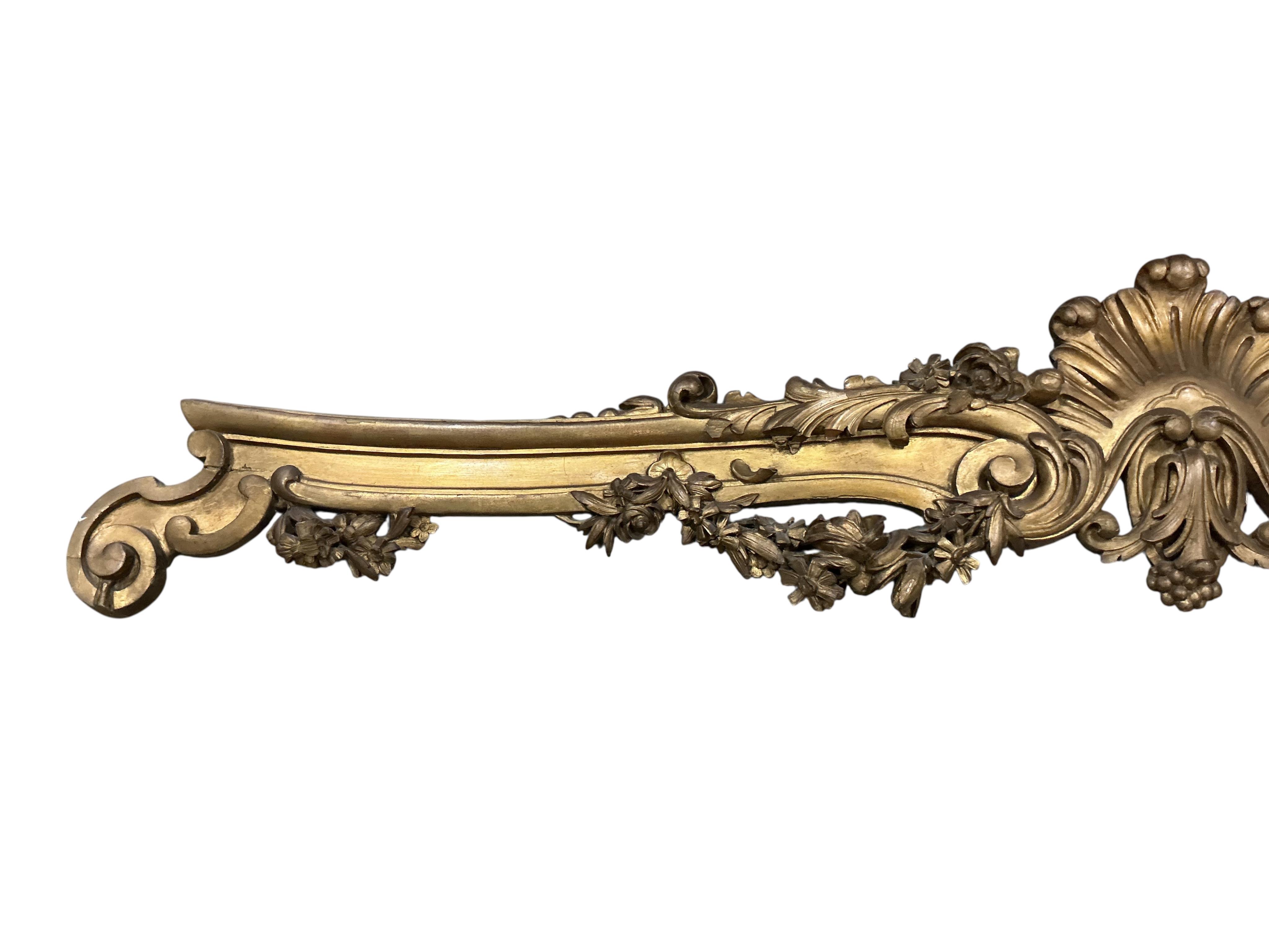 A Victorian carved giltwood pediment, length 200cm